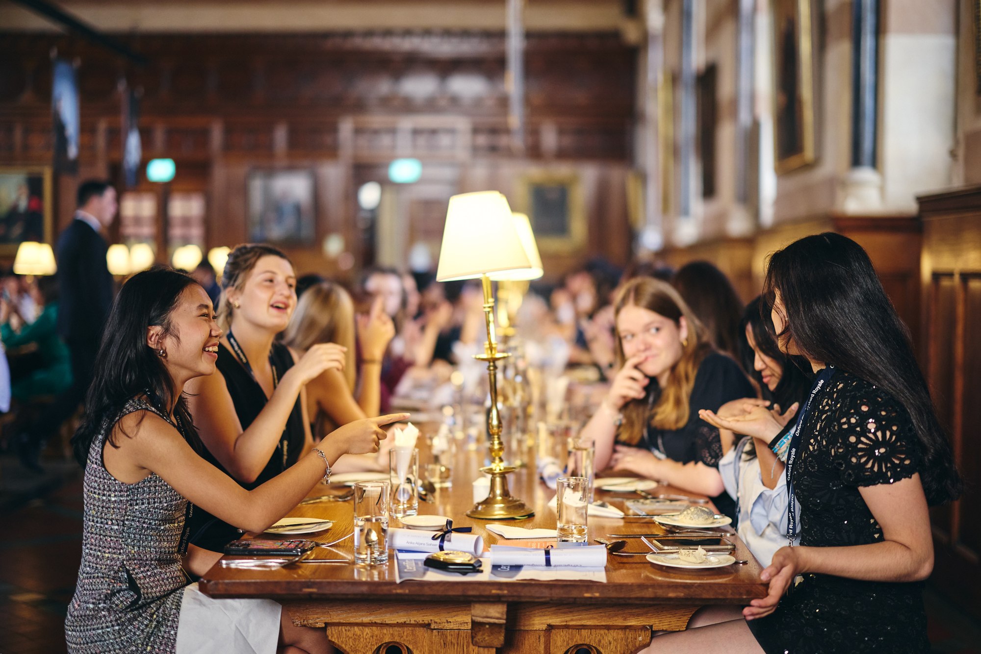 Students together in a historic college dining hall